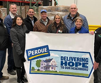 Perdue Farms donated two truckloads of chicken to the Food Bank of Delaware on Monday, January 15 to help stock the freezers at the new facility. From left to right are Perdue associates Nathan Bryner, Tim O&rsquo;Hea, Kim Nechay with the Perdue Foundation, Edgardo Torres, Chairman Jim Perdue, Holly Porter, CEO Kevin McAdams, and Cathy Kanefsky, president and CEO of the food bank, and food bank director of operations John Snarsky.