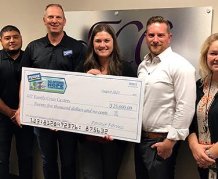 Perdue Farms delivered a $25,000 Perdue Foundation grant to Iowa Family Crisis Centers. 