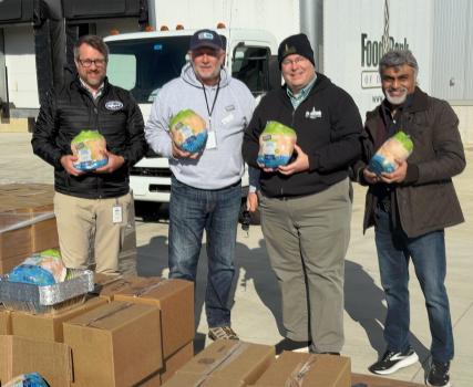 Perdue Farms, the Harry K Foundation, Food Bank of Delaware joined forces to provide holiday meals for 1,000 Delaware families and children. From left to right are Larry Hass, Development Officer, for the Food Bank of Delaware, Bill Senior, Senior Manager of Community Relations for Perdue Farms, Chad Robinson, Vice President of Government Affairs, Food Bank of Delaware, and Harry Keswanie, President and Founder of the Harry K Foundation.