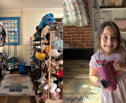 Child holding purple item in retail store with clothing displays and shelves.