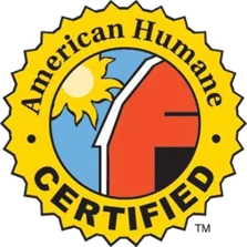 American Humane Certified logo with yellow star border, split design showing yellow bird and red barn structure.