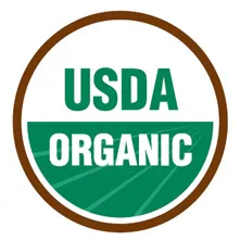 USDA Organic certification seal with green and white design in circular brown border