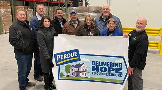 Perdue Farms donated two truckloads of chicken to the Food Bank of Delaware on Monday, January 15 to help stock the freezers at the new facility. From left to right are Perdue associates Nathan Bryner, Tim O&rsquo;Hea, Kim Nechay with the Perdue Foundation, Edgardo Torres, Chairman Jim Perdue, Holly Porter, CEO Kevin McAdams, and Cathy Kanefsky, president and CEO of the food bank, and food bank director of operations John Snarsky.