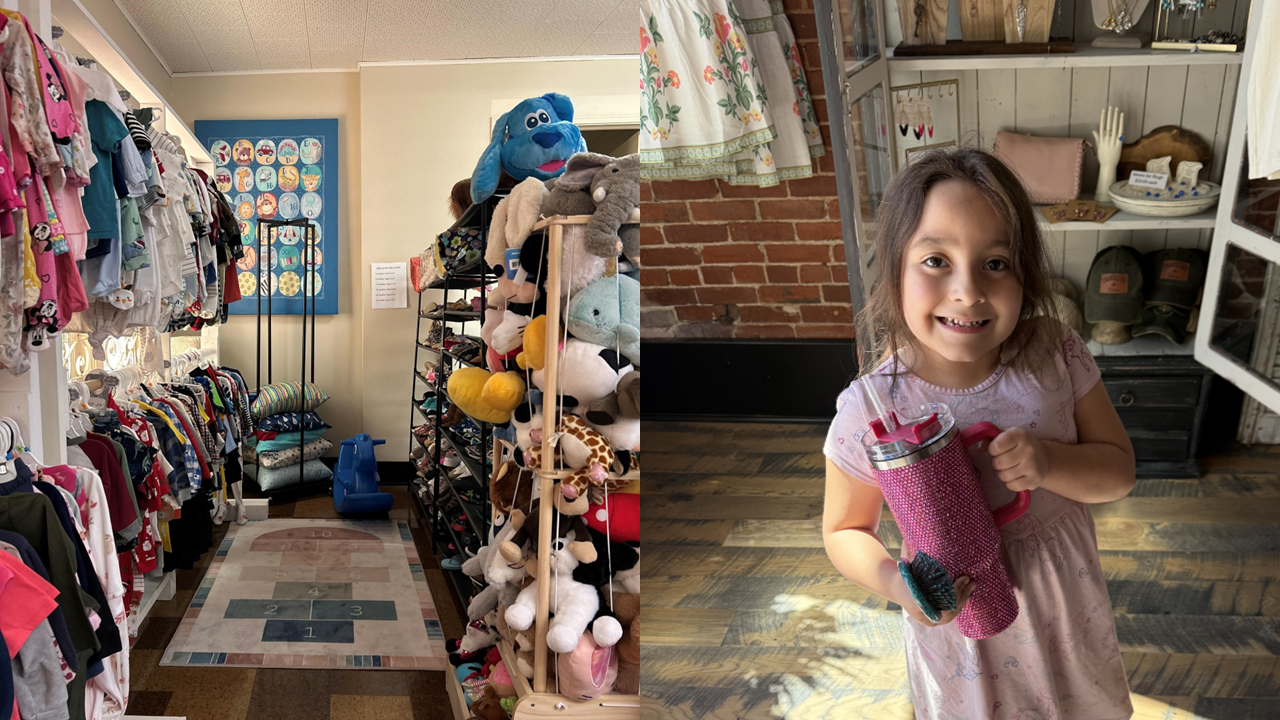 Child holding purple item in retail store with clothing displays and shelves.
